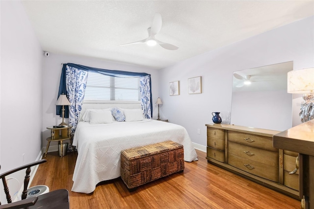 3018 59th St S Unit 405, Gulfport, FL 33707 - bedroom with light wood-type flooring and ceiling fan