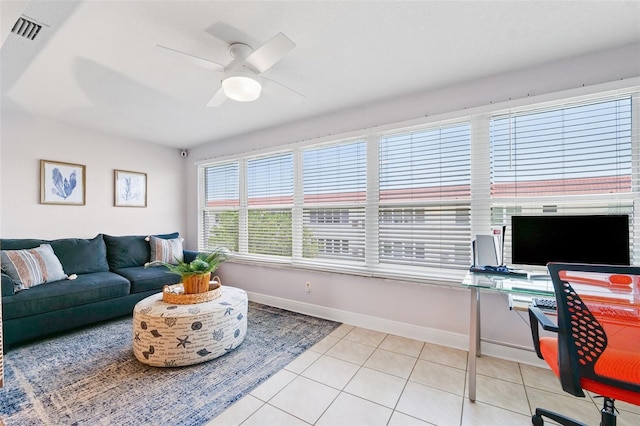3018 59th St S Unit 405, Gulfport, FL 33707 - living room featuring ceiling fan, light tile patterned floors, and a desk