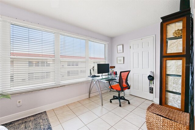 3018 59th St S Unit 405, Gulfport, FL 33707 - office area featuring baseboards and light tile patterned floors