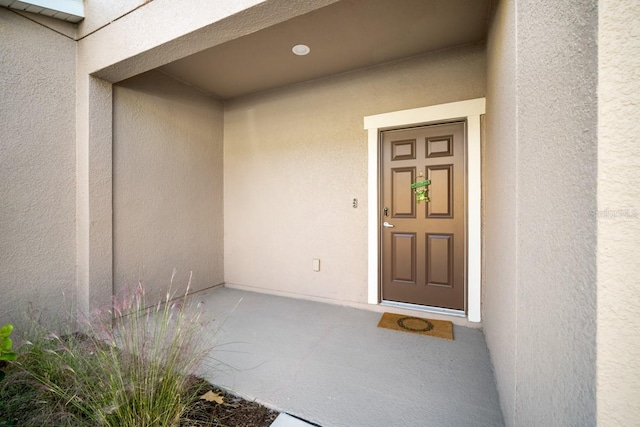 1218 Grantham Dr, Sarasota, FL 34234 - doorway to property with stucco siding