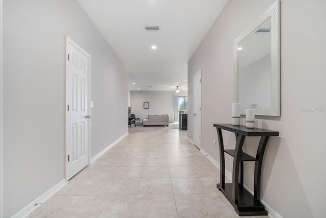 1218 Grantham Dr, Sarasota, FL 34234 - corridor featuring light tile patterned flooring and recessed lighting
