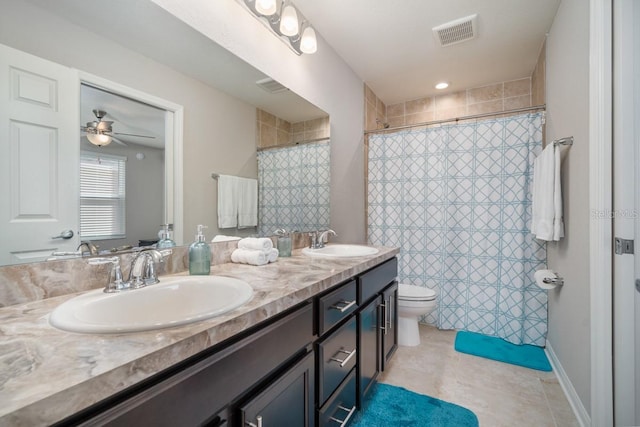1218 Grantham Dr, Sarasota, FL 34234 - full bath featuring double vanity, tiled shower, and ceiling fan
