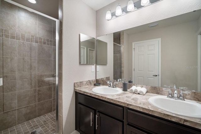 1218 Grantham Dr, Sarasota, FL 34234 - bathroom featuring double vanity and a stall shower