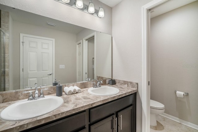 1218 Grantham Dr, Sarasota, FL 34234 - bathroom with double vanity, a tile shower, and tile patterned flooring