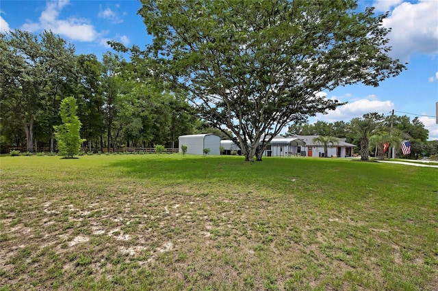 10721 N Ocean Dr, Dunnellon, FL 34434 - view of yard featuring a storage unit