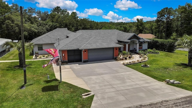 10721 N Ocean Dr, Dunnellon, FL 34434 - ranch-style house featuring a garage, driveway, a front lawn, a shingled roof, and stucco siding