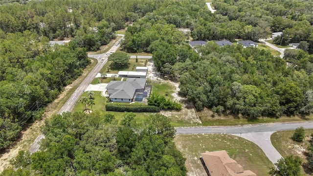 10721 N Ocean Dr, Dunnellon, FL 34434 - aerial view of property and surrounding area featuring a heavily wooded area and nearby suburban area