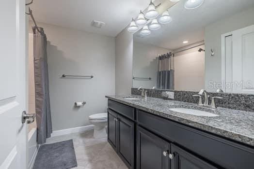 28504 Tranquil Lake Cir, Wesley Chapel, FL 33543 - full bath with double vanity and shower / tub combo
