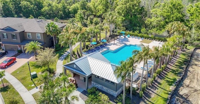 28504 Tranquil Lake Cir, Wesley Chapel, FL 33543 - view of subject property featuring a pool area and a heavily wooded area