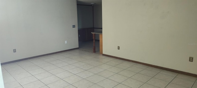 2505 W Parker St, Lakeland, FL 33815 - empty room featuring baseboards and light tile patterned flooring
