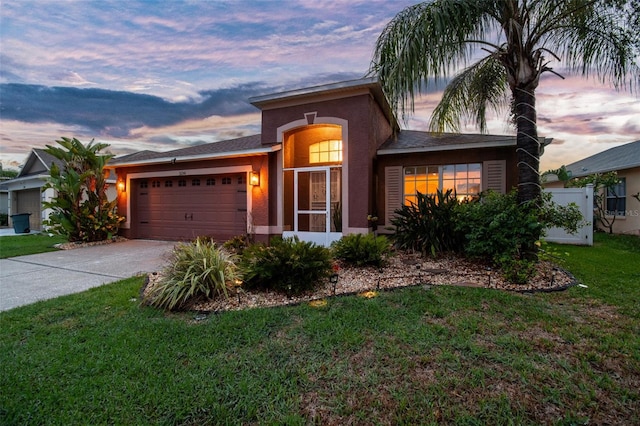 31244 Baclan Dr, Wesley Chapel, FL 33545 - ranch-style house featuring a garage, driveway, a front lawn, and stucco siding