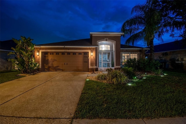 31244 Baclan Dr, Wesley Chapel, FL 33545 - ranch-style house featuring driveway, a garage, stucco siding, and a yard