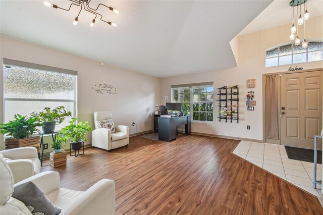31244 Baclan Dr, Wesley Chapel, FL 33545 - entryway featuring a chandelier and wood finished floors