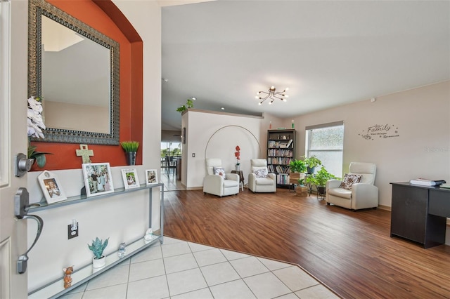 31244 Baclan Dr, Wesley Chapel, FL 33545 - living room featuring wood finished floors and a chandelier