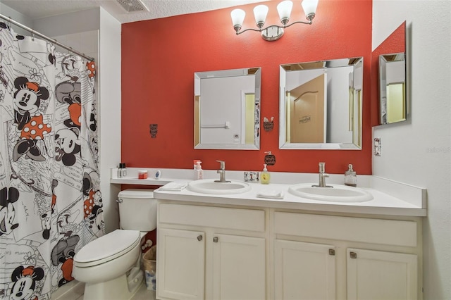 31244 Baclan Dr, Wesley Chapel, FL 33545 - bathroom featuring double vanity, a shower with curtain, and a textured ceiling