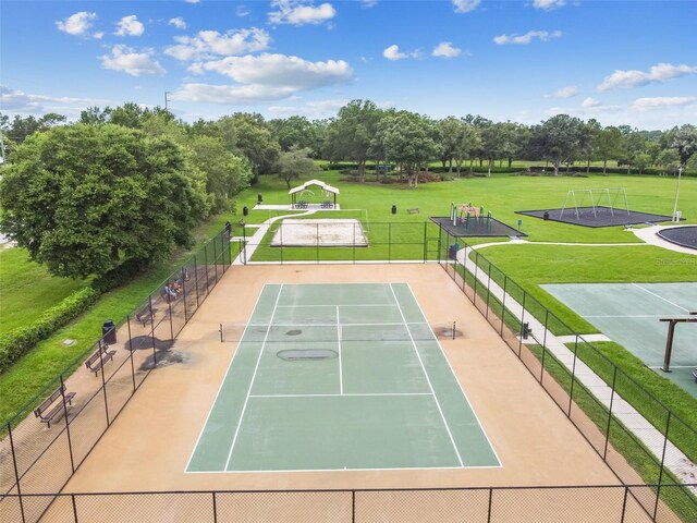 31244 Baclan Dr, Wesley Chapel, FL 33545 - view of tennis court with a gazebo and view of wooded area