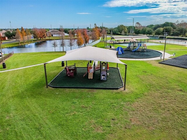 31244 Baclan Dr, Wesley Chapel, FL 33545 - view of community with a water view and a yard