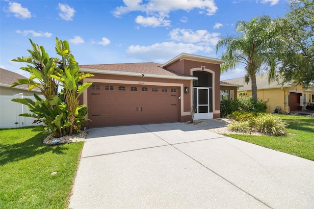31244 Baclan Dr, Wesley Chapel, FL 33545 - single story home featuring a garage, driveway, a front lawn, and stucco siding