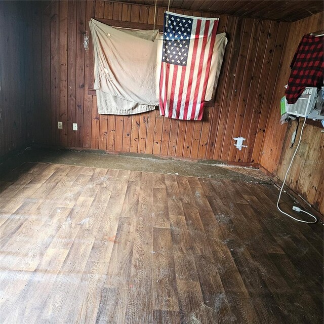 249 Chesney Blvd, Frostproof, FL 33843 - unfurnished room with hardwood / wood-style floors, wooden walls, and cooling unit