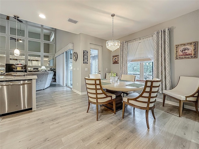 33668 Willow Point Ct, Wesley Chapel, FL 33545 - dining area featuring a chandelier, light wood-type flooring, and recessed lighting