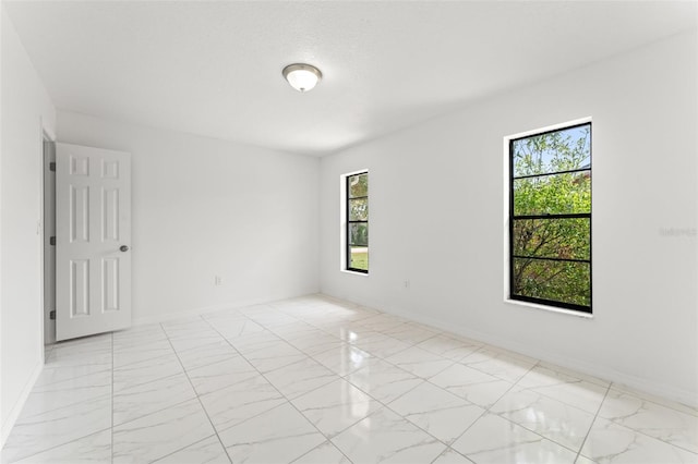 10237 Carrin Rd, Spring Hill, FL 34608 - unfurnished room featuring light marble finish floors and baseboards