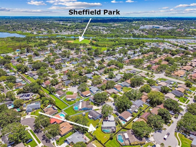 1910 Montego Ct, Oldsmar, FL 34677 - aerial perspective of suburban area with a nearby body of water