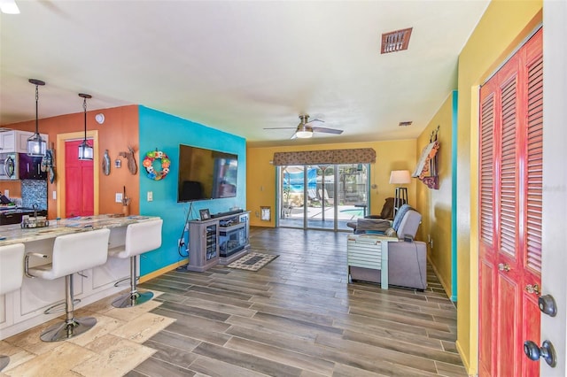 1910 Montego Ct, Oldsmar, FL 34677 - living room with a ceiling fan and wood finished floors