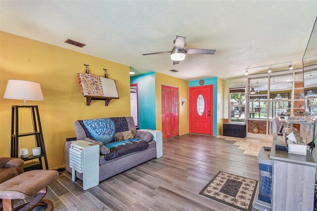 1910 Montego Ct, Oldsmar, FL 34677 - living area featuring wood finished floors and ceiling fan