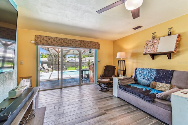 1910 Montego Ct, Oldsmar, FL 34677 - living area featuring wood finished floors and a ceiling fan