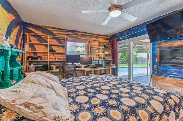 1910 Montego Ct, Oldsmar, FL 34677 - bedroom featuring a textured ceiling, access to exterior, and a ceiling fan