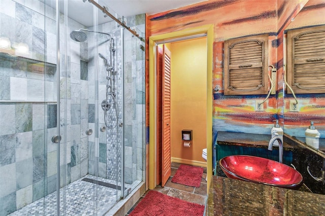 1910 Montego Ct, Oldsmar, FL 34677 - bathroom with a shower stall, vanity, and stone finish flooring