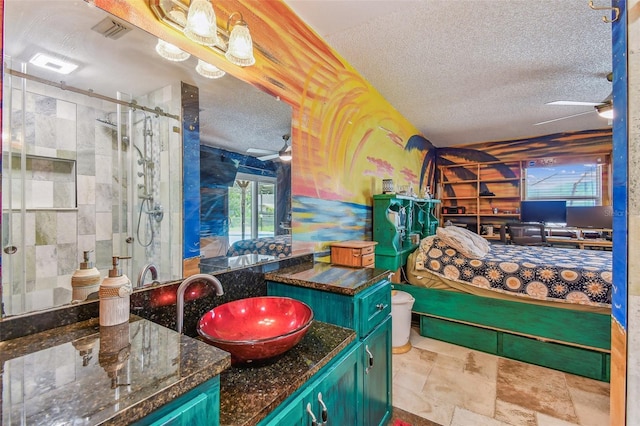 1910 Montego Ct, Oldsmar, FL 34677 - full bathroom featuring a ceiling fan, a shower stall, a textured ceiling, and vanity