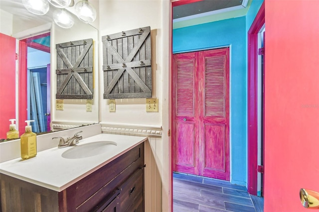 1910 Montego Ct, Oldsmar, FL 34677 - bathroom featuring vanity and wood finished floors