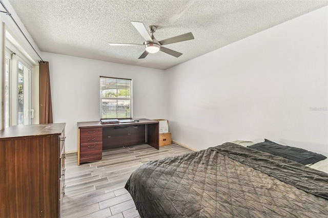 1910 Montego Ct, Oldsmar, FL 34677 - bedroom with wood tiled floors, a textured ceiling, and ceiling fan