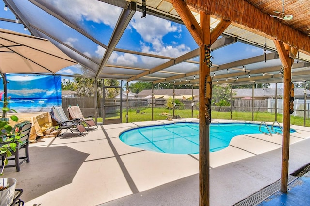 1910 Montego Ct, Oldsmar, FL 34677 - view of swimming pool featuring a patio, a fenced backyard, and glass enclosure