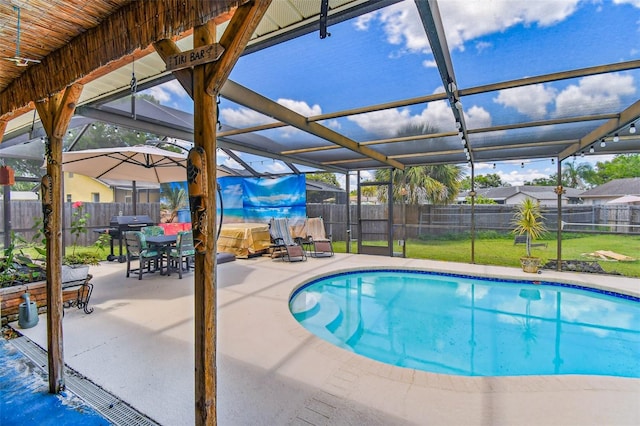 1910 Montego Ct, Oldsmar, FL 34677 - view of swimming pool featuring a patio area, grilling area, glass enclosure, and a fenced backyard