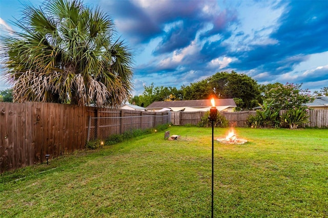 1910 Montego Ct, Oldsmar, FL 34677 - fenced backyard with an outdoor fire pit
