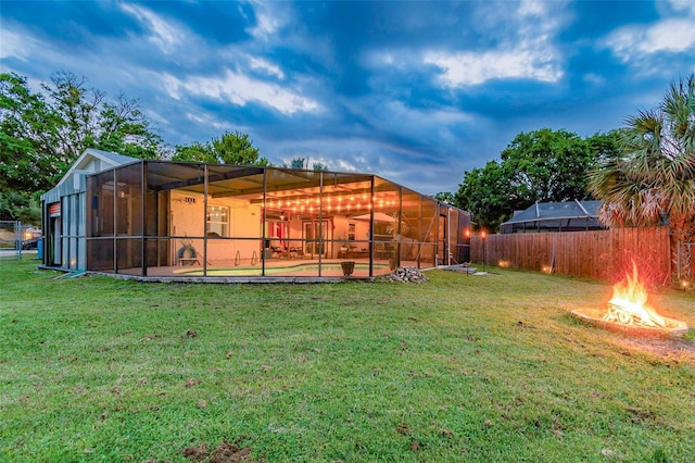 1910 Montego Ct, Oldsmar, FL 34677 - back of property featuring a fire pit, a lanai, and a swimming pool