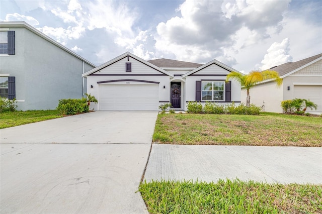 9098 Forge Breeze Loop, Wesley Chapel, FL 33545 - view of front of property featuring a garage, driveway, a front lawn, and stucco siding