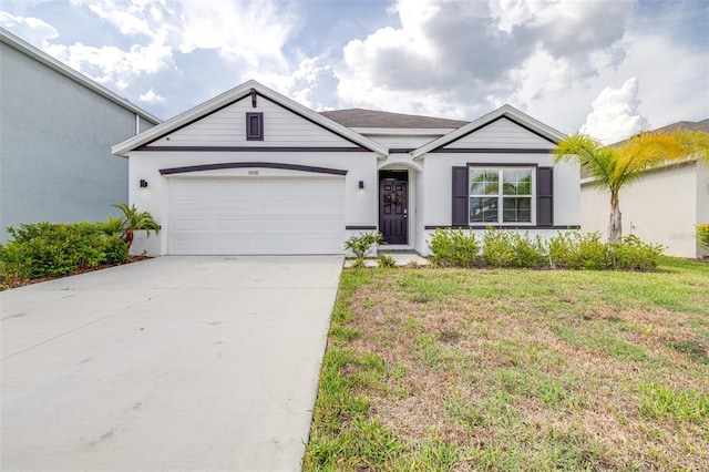 9098 Forge Breeze Loop, Wesley Chapel, FL 33545 - single story home featuring concrete driveway, a garage, stucco siding, and a front lawn