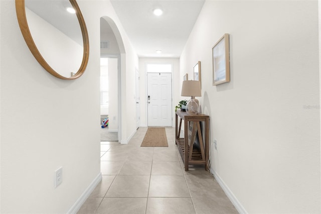 9098 Forge Breeze Loop, Wesley Chapel, FL 33545 - hall with light tile patterned floors and recessed lighting