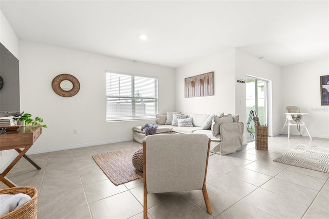 9098 Forge Breeze Loop, Wesley Chapel, FL 33545 - living area with healthy amount of natural light, light tile patterned floors, and recessed lighting