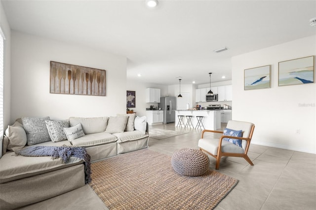 9098 Forge Breeze Loop, Wesley Chapel, FL 33545 - living room featuring recessed lighting and light tile patterned floors