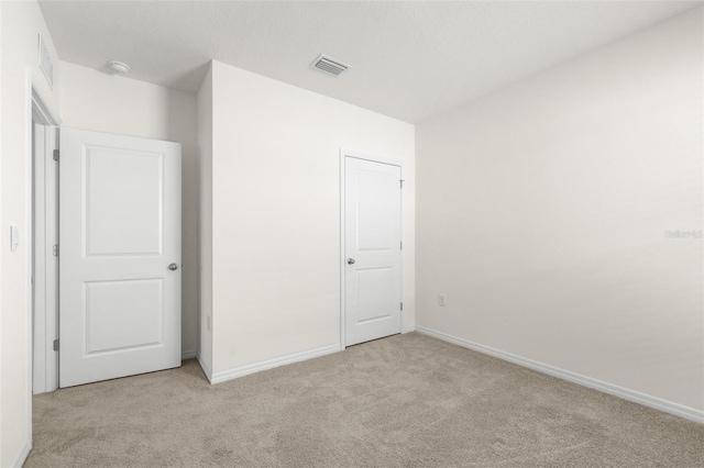 9098 Forge Breeze Loop, Wesley Chapel, FL 33545 - unfurnished bedroom featuring carpet floors and baseboards