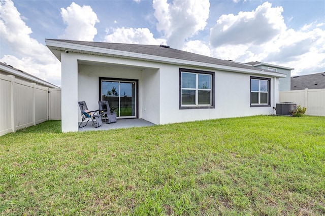 9098 Forge Breeze Loop, Wesley Chapel, FL 33545 - rear view of house featuring a fenced backyard, a patio area, and stucco siding