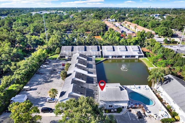 500 New York Ave Unit 22, Dunedin, FL 34698 - aerial view of property and surrounding area featuring a nearby body of water and a pool area
