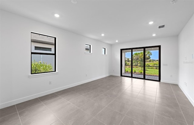 6133 Wire Grass Ct, Nokomis, FL 34275 - empty room with tile patterned flooring and recessed lighting