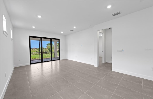 6133 Wire Grass Ct, Nokomis, FL 34275 - spare room with recessed lighting and tile patterned floors