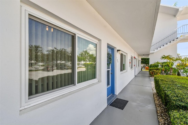 8080 112th St Unit 108, Seminole, FL 33772 - view of exterior entry featuring stucco siding