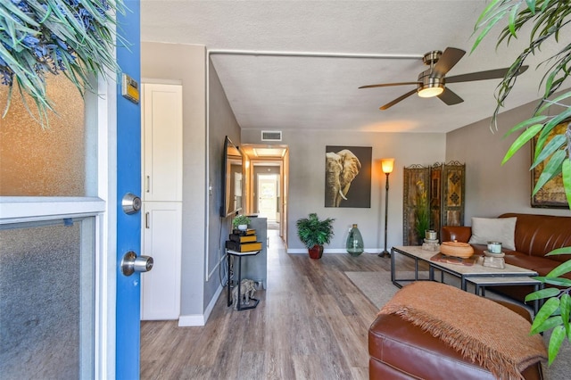 8080 112th St Unit 108, Seminole, FL 33772 - living area featuring wood finished floors and ceiling fan
